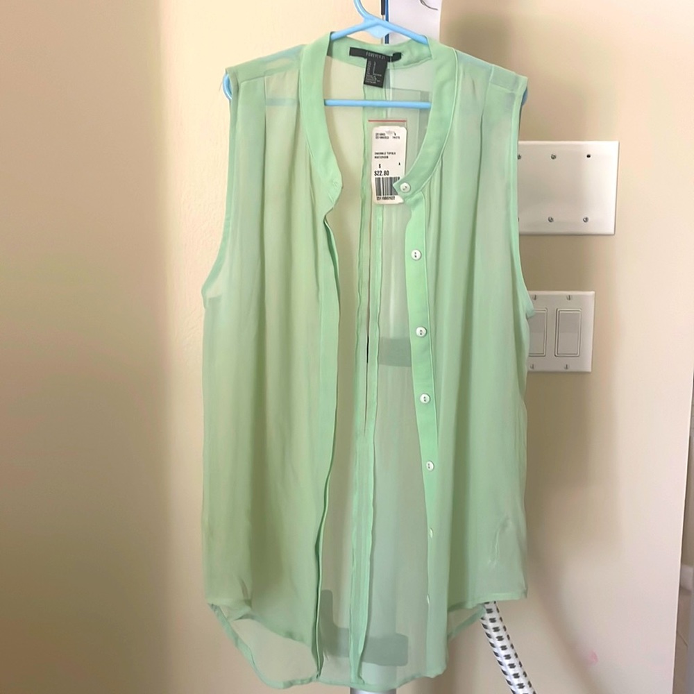 Sheer top with slit in back.